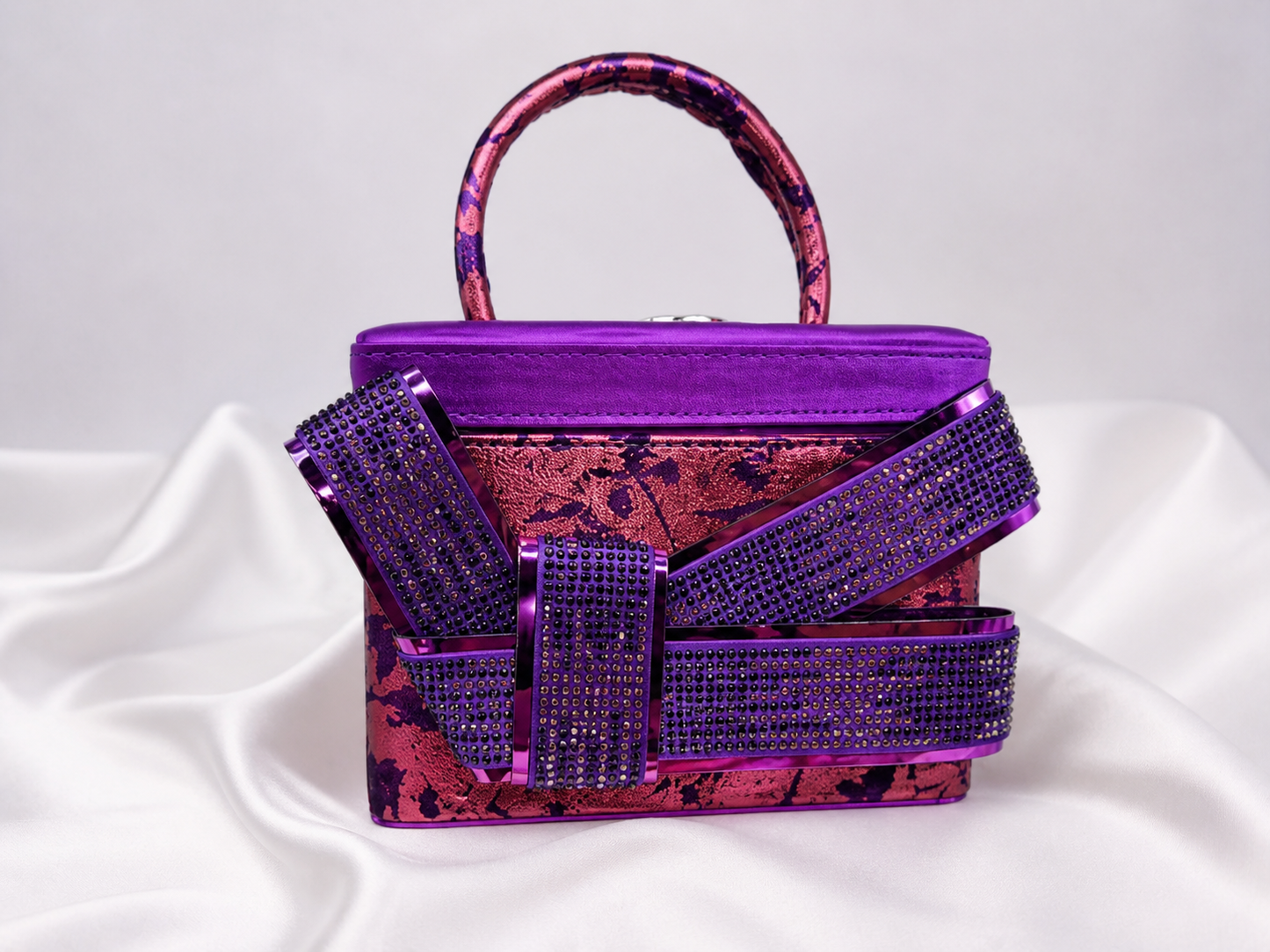Purple and rose handbag with decorative straps for African weddings