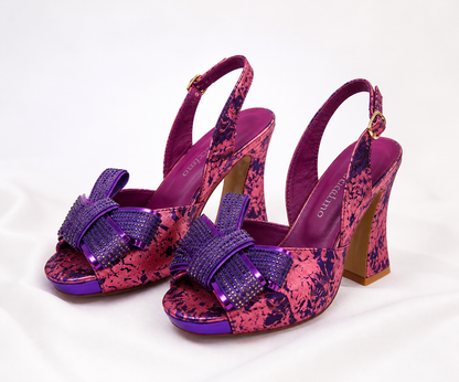 Pair of pink and purple high-heeled shoes with floral patterns for weddings