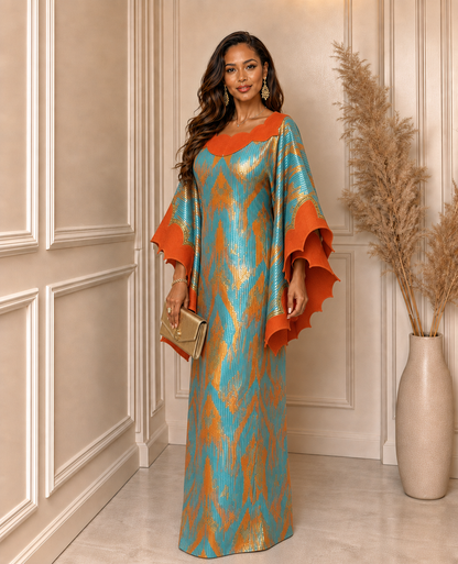 Teal and orange African boubou dress with abstract print, orange scalloped neckline, wide dramatic sleeves and full-length modest silhouette.